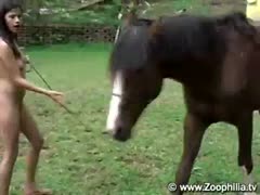 Sexy brunette plays dirty games with a horse